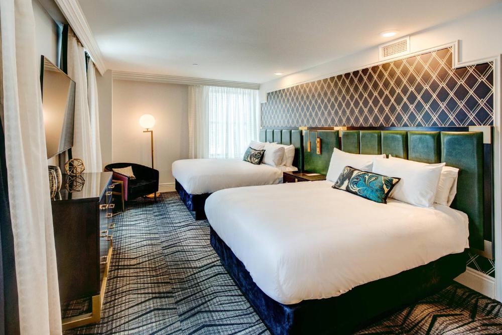 Deluxe Queen Room with Two Queen Beds and Balcony interior